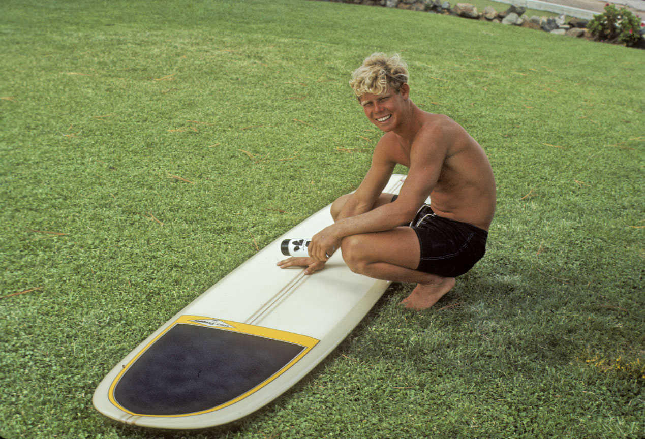 Young Gary Propper with his surfboard