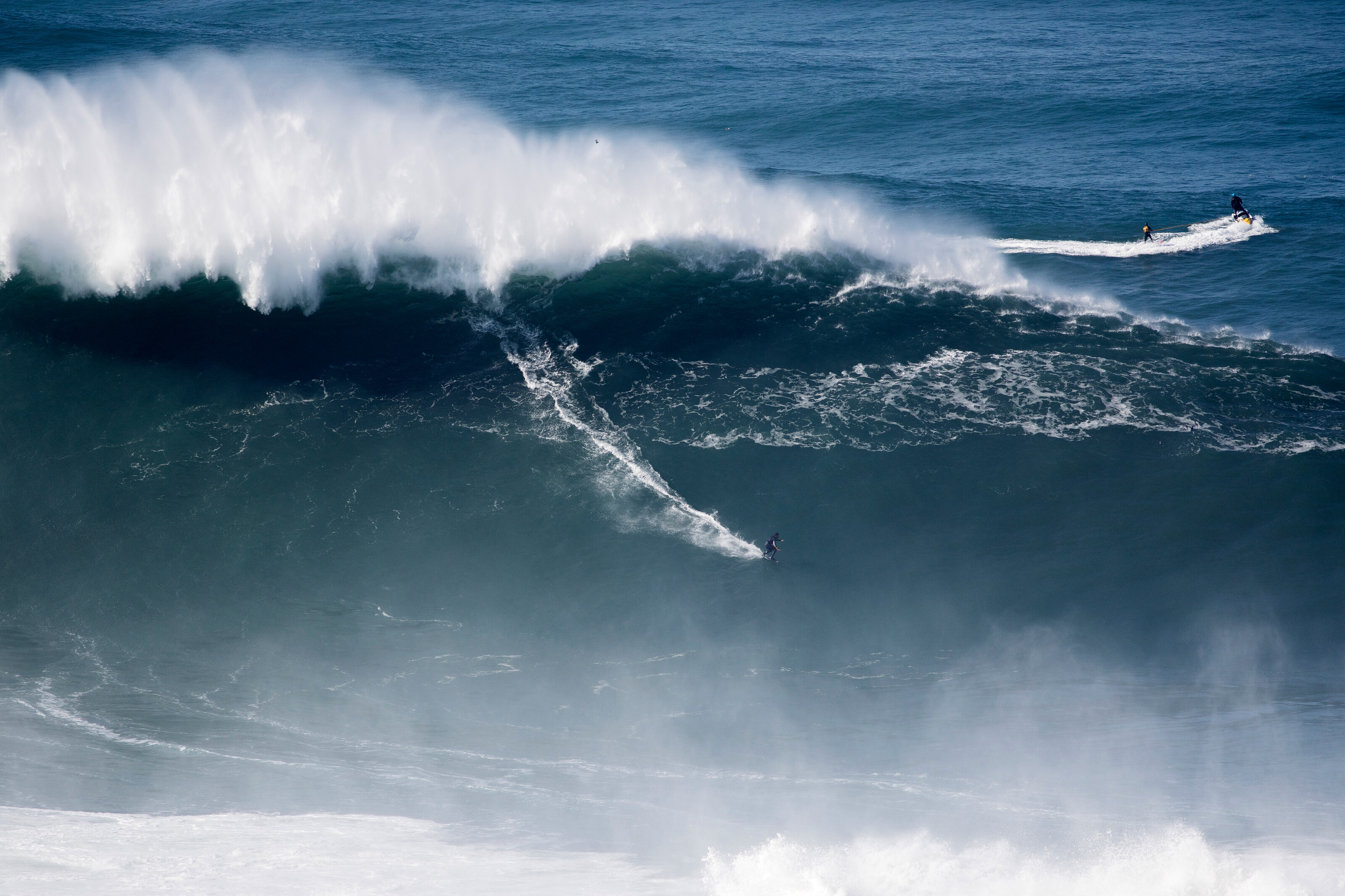 Big wave surfer Pedro Scooby from Brazil rides a wave during a tow